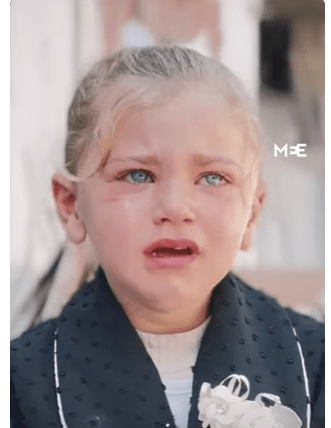 Palestinian girl cries over her destroyed kindergarten in Gaza